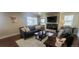 Cozy living room with a stone fireplace, a comfortable sofa set, and stylish decor at 2525 S Pennsylvania St, Denver, CO 80210
