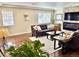 Comfortable living room featuring a stone fireplace and natural light at 2525 S Pennsylvania St, Denver, CO 80210