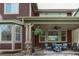 Back patio with stone column and view of the backyard at 24686 E Florida Ave, Aurora, CO 80018