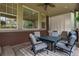 Covered patio with outdoor seating and view of the backyard at 24686 E Florida Ave, Aurora, CO 80018