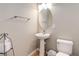 Powder bathroom with pedestal sink, toilet, and neutral decor at 24686 E Florida Ave, Aurora, CO 80018