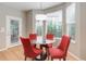 Breakfast nook featuring bright red chairs and a view of the outdoors through the large windows at 24686 E Florida Ave, Aurora, CO 80018