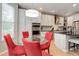 Bright breakfast nook with a round glass table, seating for four, and built-in oven at 24686 E Florida Ave, Aurora, CO 80018