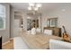 Spacious dining room features hardwood floors, seating for six, and access to other rooms at 24686 E Florida Ave, Aurora, CO 80018