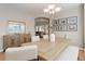 Dining room with wood table and seating for six, as well as decorative mirror and storage at 24686 E Florida Ave, Aurora, CO 80018