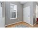 Bright entryway with hardwood floors, a window, and a white door at 24686 E Florida Ave, Aurora, CO 80018