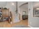 Spacious foyer features hardwood floors, staircase, and stylish decor at 24686 E Florida Ave, Aurora, CO 80018