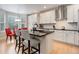 Modern kitchen with stainless steel appliances, center island, and breakfast nook at 24686 E Florida Ave, Aurora, CO 80018