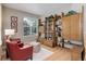 Cozy living room with a large window, wooden cabinetry, and comfortable seating at 24686 E Florida Ave, Aurora, CO 80018