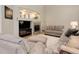 Cozy living room with a fireplace, tv, and comfortable furniture at 24686 E Florida Ave, Aurora, CO 80018