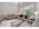 Bright living room featuring neutral color palette, large windows, and high ceilings at 24686 E Florida Ave, Aurora, CO 80018