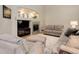Cozy living room with a fireplace, decorative mantel, and comfortable seating at 24686 E Florida Ave, Aurora, CO 80018