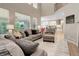 Open living room with high ceilings connecting to the kitchen area at 24686 E Florida Ave, Aurora, CO 80018