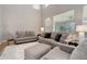 Living room with high ceilings, large windows, and comfortable seating at 24686 E Florida Ave, Aurora, CO 80018