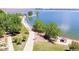 Scenic aerial view of a park and lake featuring lush greenery, sandy beaches, and recreational water activities at 6390 S Xanadu St, Englewood, CO 80111