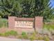 Community entrance sign for Village at Centennial with manicured landscaping at 6390 S Xanadu St, Englewood, CO 80111