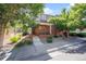 Charming brick home with well-maintained front yard and welcoming entrance at 6390 S Xanadu St, Englewood, CO 80111