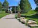 Scenic park path surrounded by lush greenery and decorative rock formations at 6390 S Xanadu St, Englewood, CO 80111