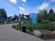 Centennial Center Park's inviting entry features a colorful sign, with a playground visible in the background at 6390 S Xanadu St, Englewood, CO 80111