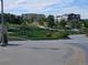 A relaxing outdoor space with picnic tables, green lawns, colorful flowers, and nearby apartments at 6390 S Xanadu St, Englewood, CO 80111