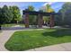 Community picnic area with covered seating, tables, and green lawn at 6390 S Xanadu St, Englewood, CO 80111