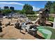 playground with climbing structures, slides, and soft landing surfaces at 6390 S Xanadu St, Englewood, CO 80111