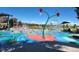 Community splash pad with colorful water features and playful design elements at 6390 S Xanadu St, Englewood, CO 80111