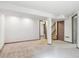 Spacious unfinished basement with carpet flooring, white walls, and neutral trim at 19739 E Wagontrail Dr, Centennial, CO 80015