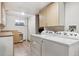 Basement laundry room with washer and dryer, storage cabinets, and a folding counter at 19739 E Wagontrail Dr, Centennial, CO 80015