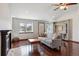 Bright living room with hardwood floors, fireplace, built-in shelving, and natural light at 19739 E Wagontrail Dr, Centennial, CO 80015