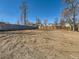 Spacious vacant backyard with dirt and wooden fence at 5951 Oneida St, Commerce City, CO 80022