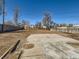 Large vacant backyard featuring a patio and wooden fence at 5951 Oneida St, Commerce City, CO 80022