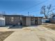 Backyard featuring a patio and backyard entry to the home at 5951 Oneida St, Commerce City, CO 80022