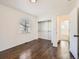 Bedroom featuring a window, open closet, and adjacent bathroom at 5951 Oneida St, Commerce City, CO 80022