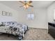 Cozy bedroom featuring a ceiling fan, window, and comfy carpet at 5951 Oneida St, Commerce City, CO 80022