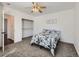 Bedroom with closet, and open doorway at 5951 Oneida St, Commerce City, CO 80022