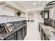 Bright, updated kitchen featuring granite countertops, mosaic backsplash, and ample storage at 5951 Oneida St, Commerce City, CO 80022