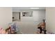 View of a basement recreation space with plush carpet, stroller, and rocking horse at 11615 E Maplewood Ave, Englewood, CO 80111
