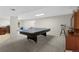 Spacious basement rec room featuring a ping pong table, and neutral carpet at 11615 E Maplewood Ave, Englewood, CO 80111