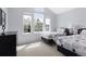 Bedroom with two twin beds, large window with natural light and carpet at 11615 E Maplewood Ave, Englewood, CO 80111