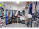 Walk-in closet with organized shelving and racks for ample storage at 11615 E Maplewood Ave, Englewood, CO 80111