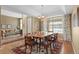 Elegant dining room with natural light, a spacious table, and stylish decor at 11615 E Maplewood Ave, Englewood, CO 80111