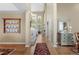 Inviting foyer with high ceilings, hardwood floors, and decorative display case at 11615 E Maplewood Ave, Englewood, CO 80111