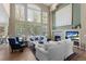 Bright living room with high ceilings, a fireplace, and comfortable seating at 11615 E Maplewood Ave, Englewood, CO 80111