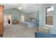 Spacious main bedroom with vaulted ceiling, ceiling fan and light blue walls at 11615 E Maplewood Ave, Englewood, CO 80111