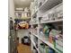 Walk-in pantry with floor-to-ceiling shelving, offering plenty of space for storage and organization of food items at 11615 E Maplewood Ave, Englewood, CO 80111