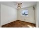 Empty bedroom featuring brown carpet, a window providing natural light, and minimalist decor at 11644 Jackson St, Thornton, CO 80233