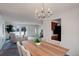 Open-concept dining area showcasing a chandelier and access to the living room and kitchen at 11644 Jackson St, Thornton, CO 80233