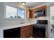 Well-lit kitchen featuring ample cabinet space, a gas range, and modern appliances at 11644 Jackson St, Thornton, CO 80233