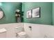 Stylish powder bathroom with green accent wall, modern decor, and wainscoting at 1539 Bennet Mountain Rd, Castle Rock, CO 80109